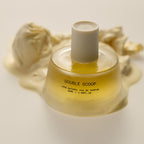 Double Scoop Eau de Parfum – yellow glass bottle 50ml, cream cap on white background – perfume