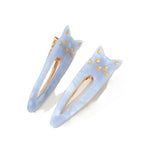 Katze Oval Saltwater Blue – light blue hair clips with gold cat detailing, white background – hair styling