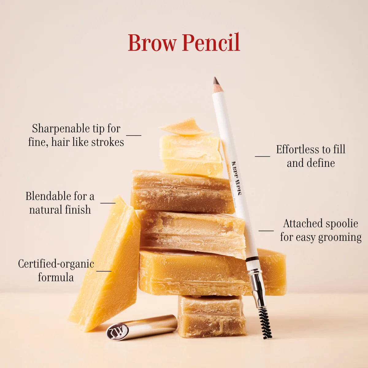 KW Brow Pencil – white pencil with spoolie, gold cap, beige background – eyebrow styling