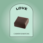 Nut Butter Chocolate Cashew & Matcha – square praline, mint green background – beauty snack