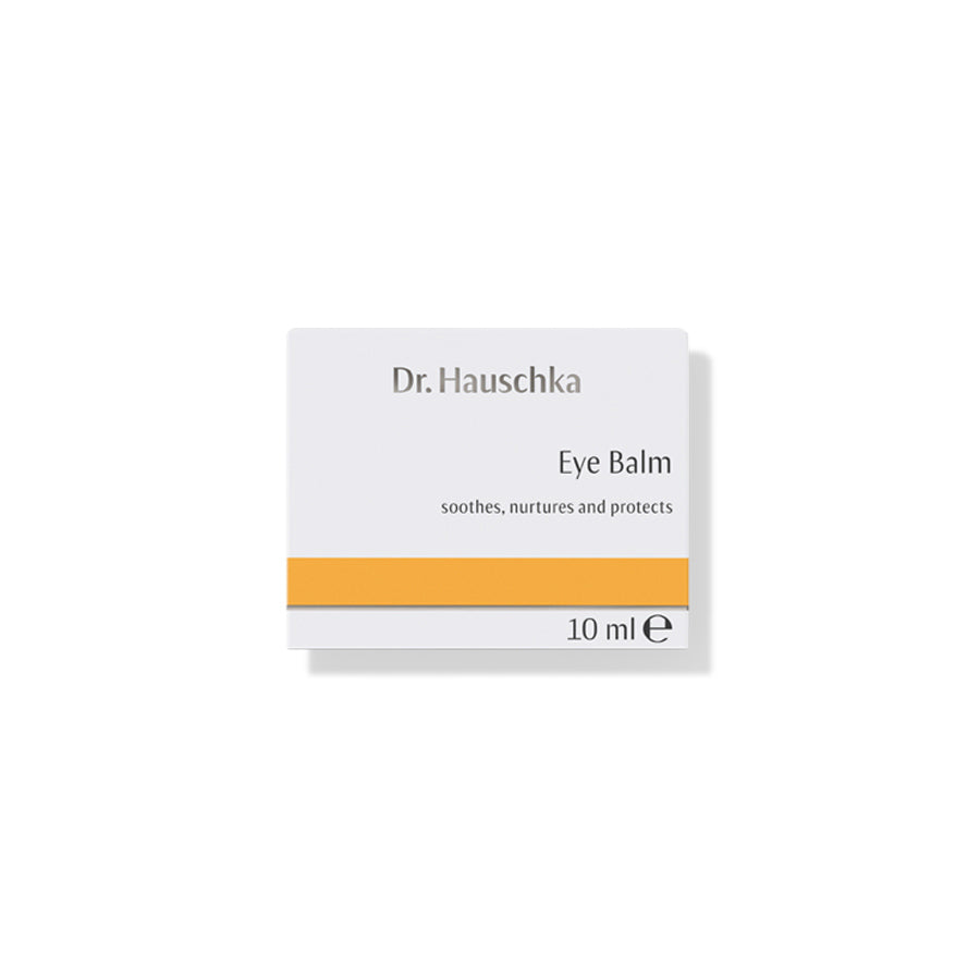 Dr. Hauschka Augenbalsam – 10 ml, weißes Etui mit orangefarbenem Streifen, weißer Hintergrund – Augenpflege