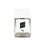 Disko Disko Parfum – clear glass bottle with white cap, white label and black text – perfume