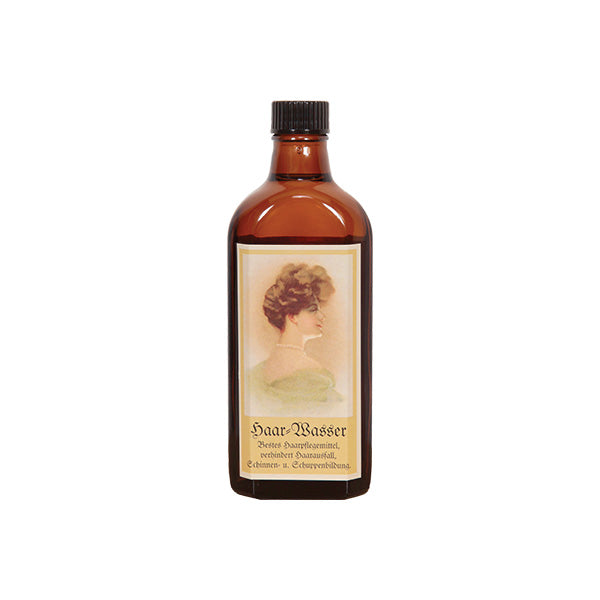 Coffein-Haarwasser – braune Glasflasche mit schwarzem Schraubverschluss, weißem Hintergrund – Haarpflege
