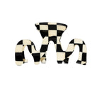 black-and-white hair clip on a white background