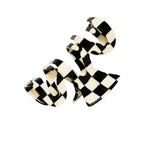 black-and-white hair clip on a white background