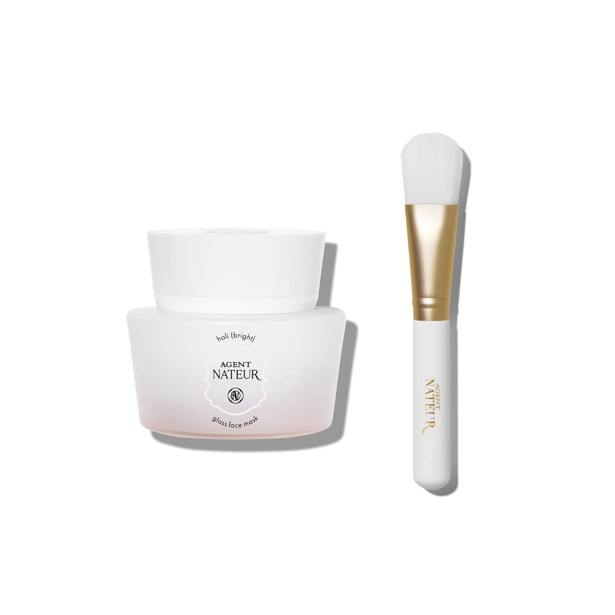 Agent Nateur Holi(bright) Resurface Glass Face Mask in a white jar with applicator brush for skin care.