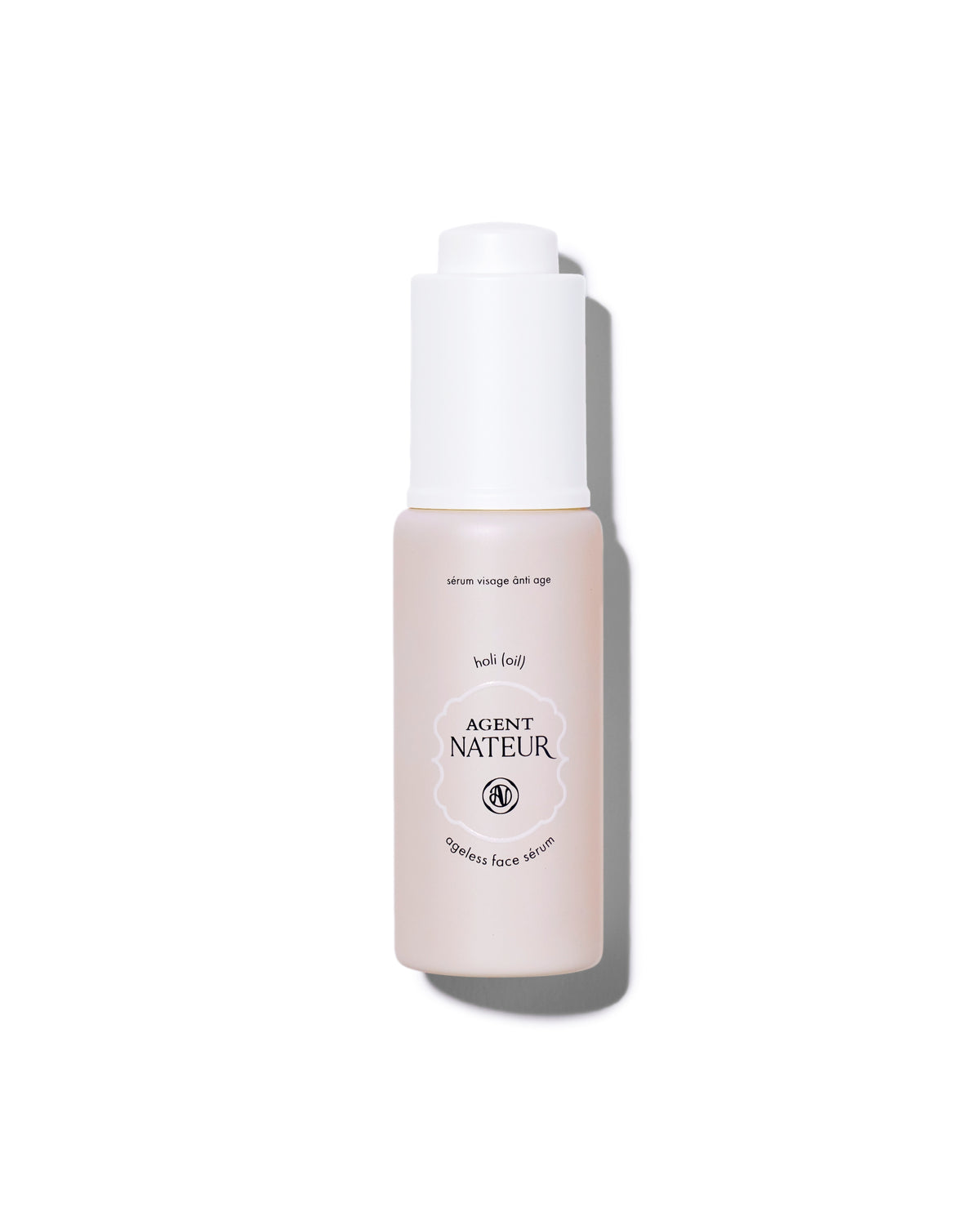Agent Nateur Holi (oil) Ageless Face Sérum in a pale pink bottle with a white pump dispenser for skin care.