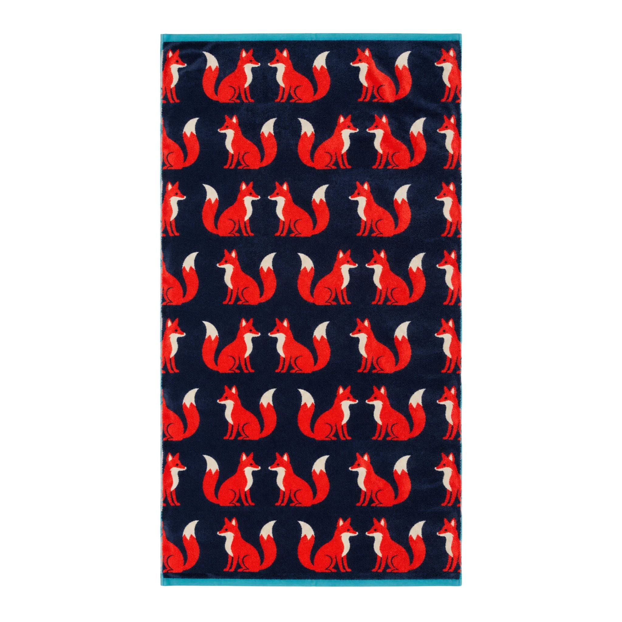 Kissing Foxes Organic Cotton Bath Sheet in navy blue with red foxes on a white background, bathroom accessory