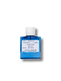 Korres Ionian Blue Eau de Toilette, blue glass bottle with white cap on white background, fragrance.