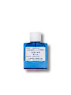 Korres Ionian Blue Eau de Toilette, blue glass bottle with white cap on white background, fragrance.