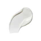 Texture of Nourishing Day Cream as a white cream swatch on a white background, skin care.