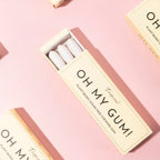 Oh My Gum! plant-based chewing gum in a beige box on a pink background, oral care