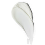 White texture of foot cream on white background for intensive foot care.