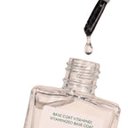 Vitaminized Base Coat in a clear glass bottle with a brush applicator on a white background, nail care.