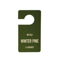 L:A Bruket No. 342 Winter Pine fragrance tag in dark green on a white background.